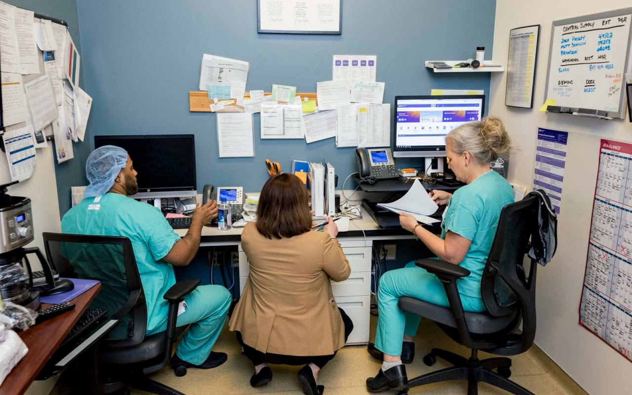 Hospital Staff Reviewing Paperwork